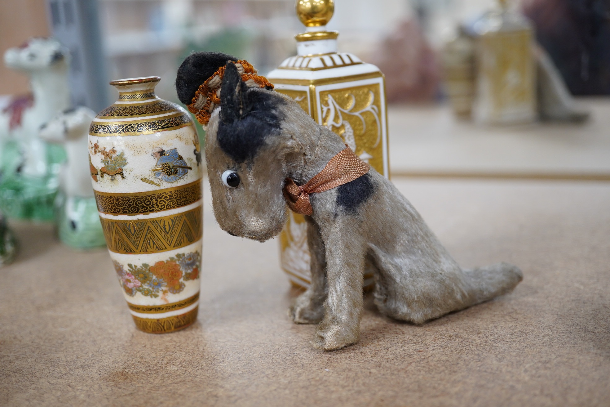 A Continental porcelain scent bottle, a small Japanese Satsuma pottery vase and a vintage soft toy Scottie dog, largest 11cm high. Condition - fair, vase neck restored